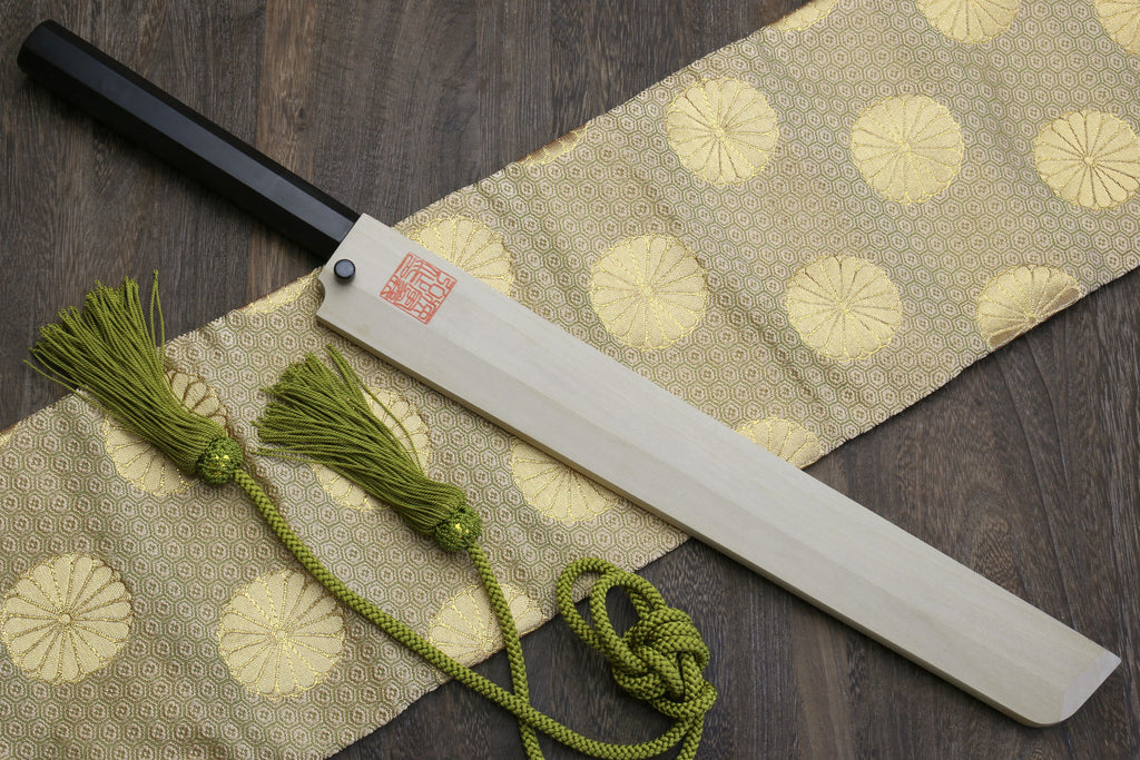 Sushi chef knife with mirror-finished blade, dark ebony handle, and green tassel cord.