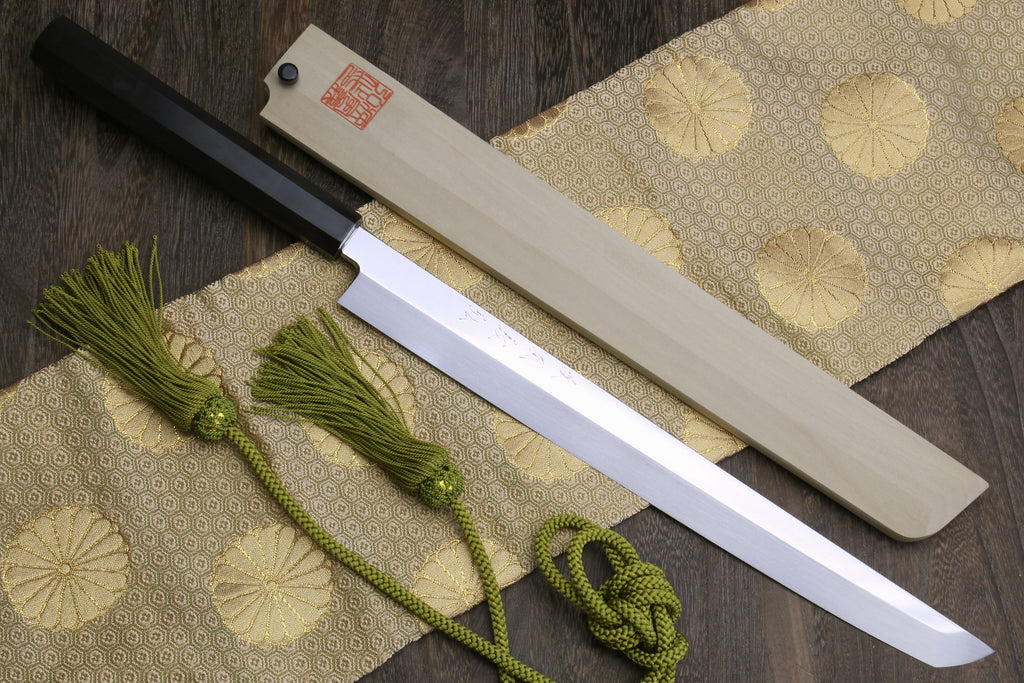 Sushi chef knife with mirror-finished white steel blade and dark ebony handle.