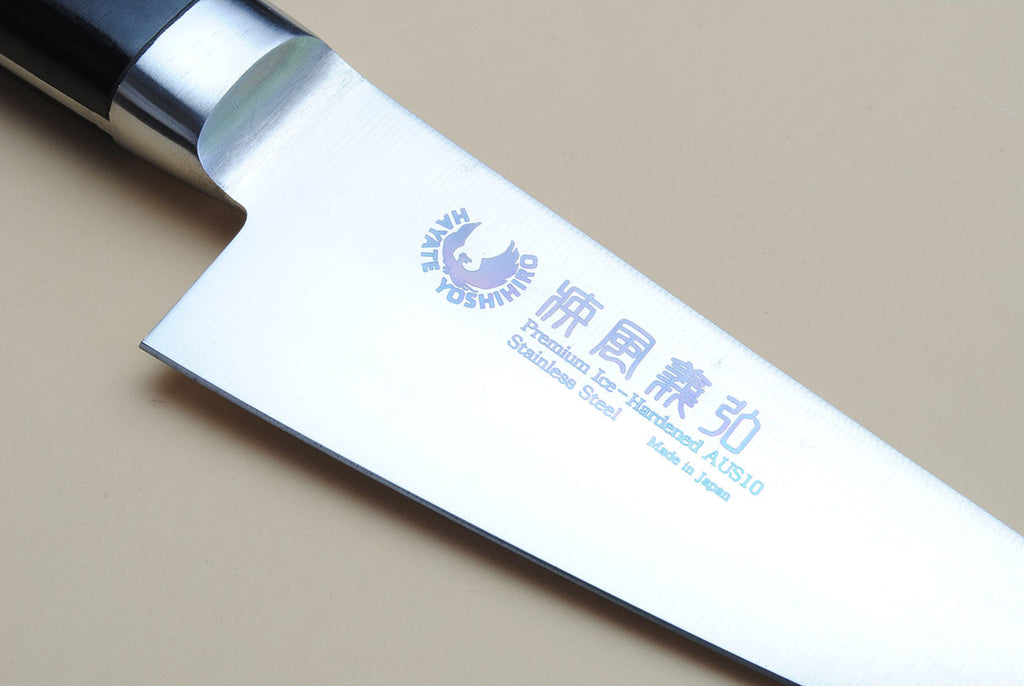 Poultry boning knife blade close-up with stamped mark and stainless steel edge