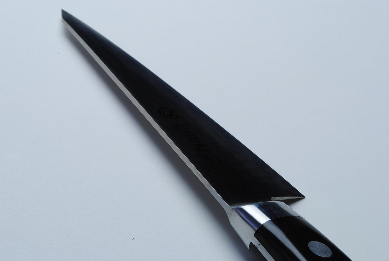 Poultry boning knife side view with dark blue handle and narrow blade