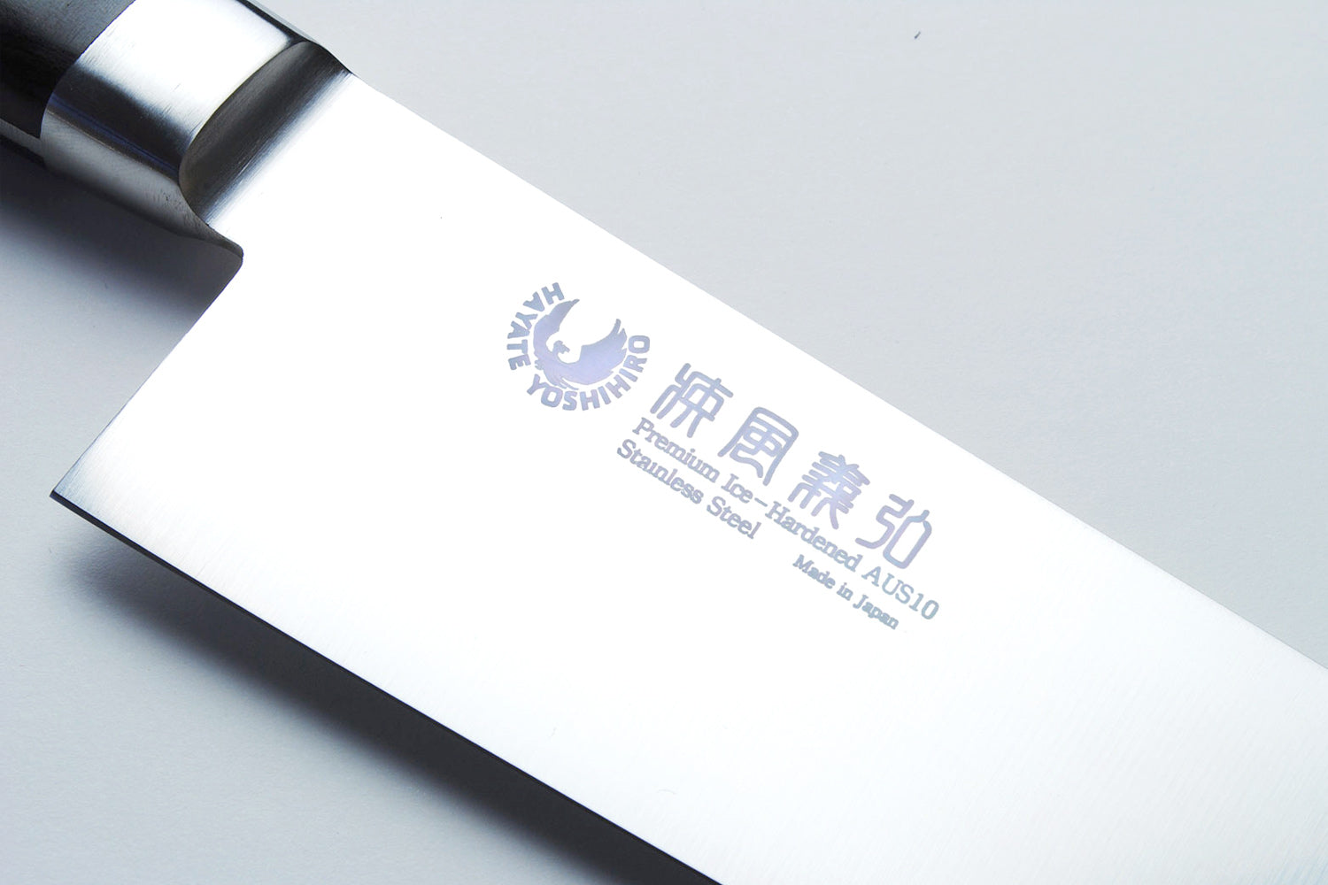 Santoku chef’s knife blade engraving on stainless steel with dark metal bolster