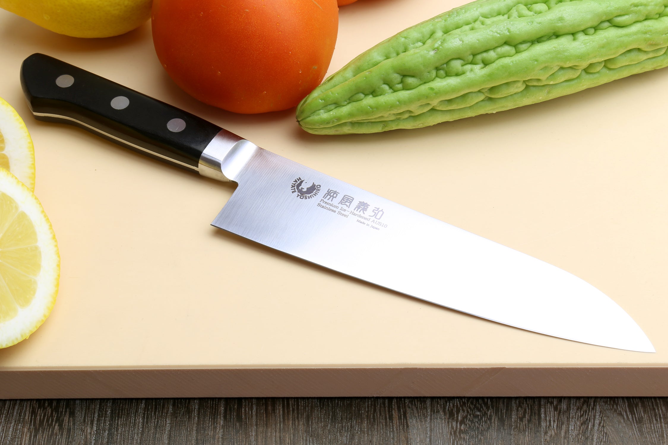 Santoku chef’s knife with white-satin steel blade and black handle with white dot rivets