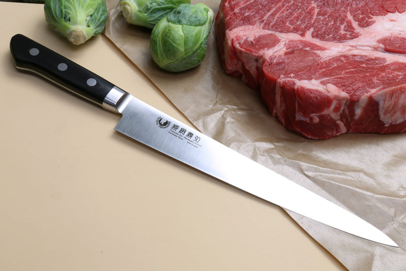 Sujihiki slicer chef knife with dark handle and long stainless blade, pointed tip