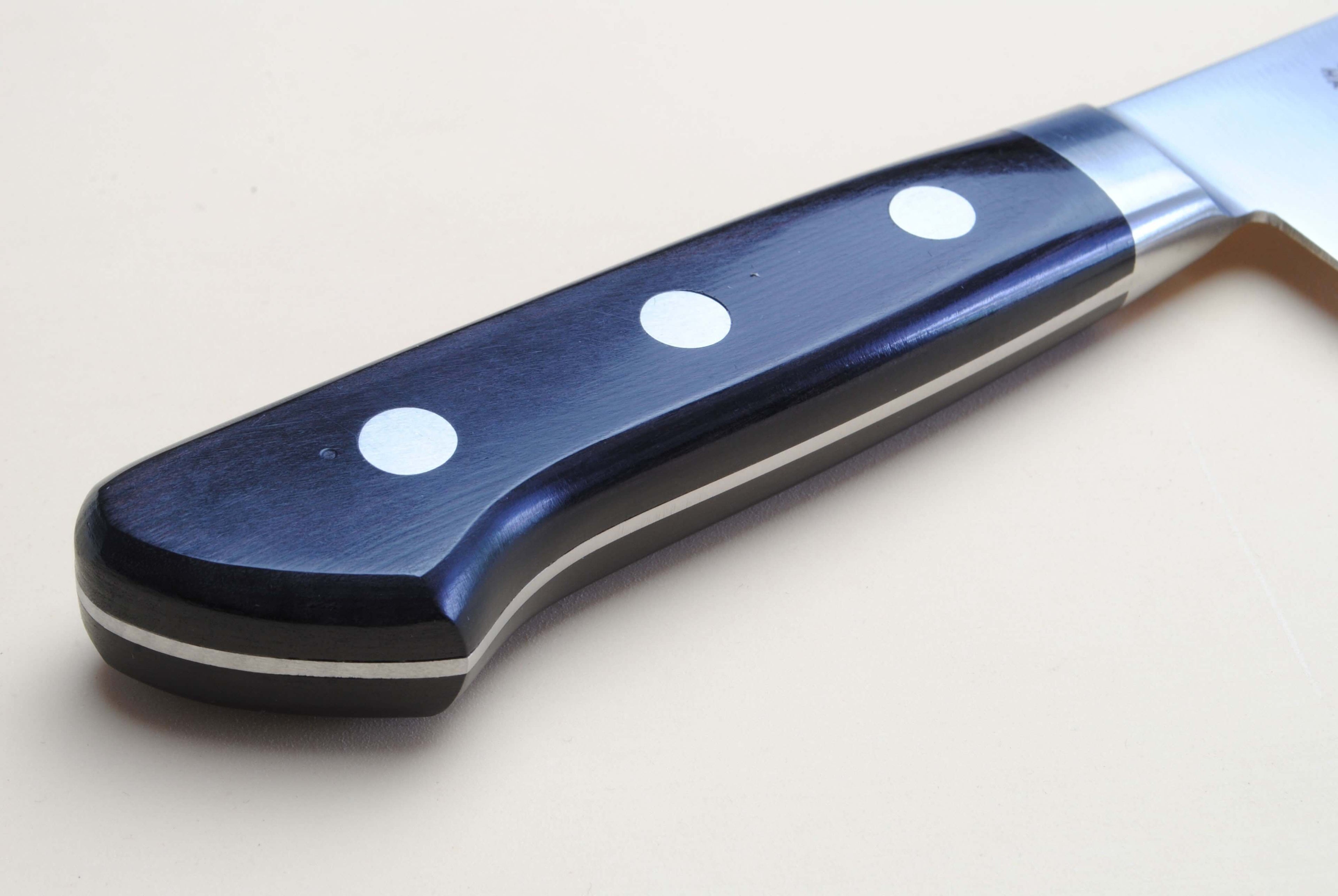Sujihiki slicer chef knife handle with blue-black scales and three white rivet dots