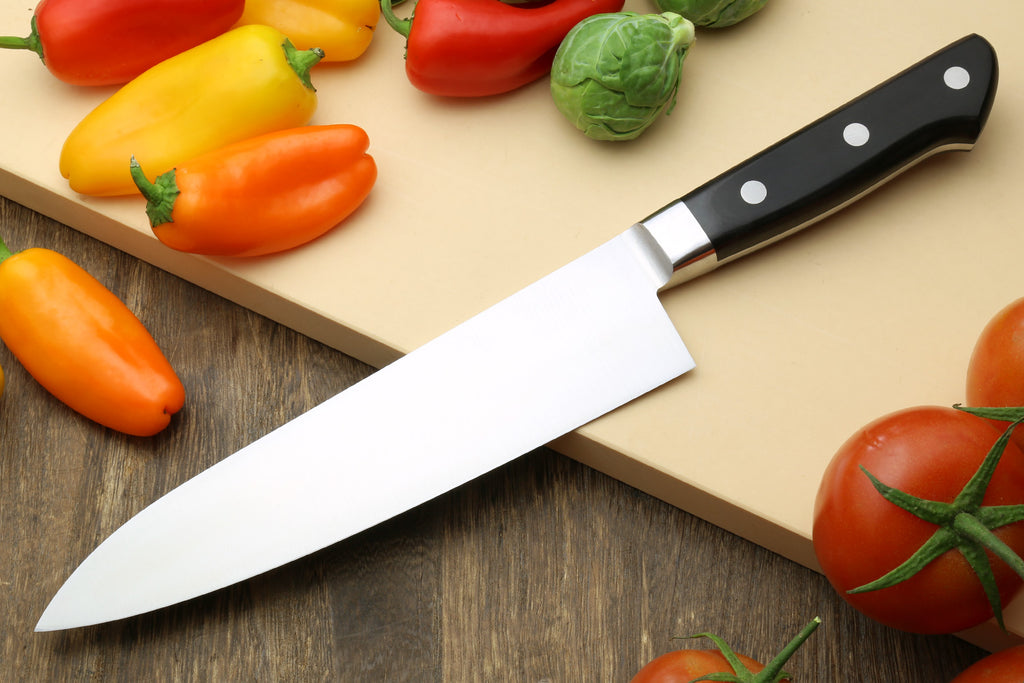 Double-edged deba fillet knife with dark handle and long silver blade, side view
