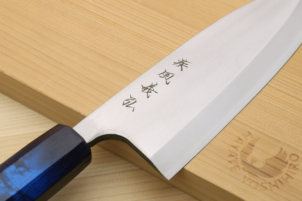 Japanese deba knife showing etched characters on stainless blade