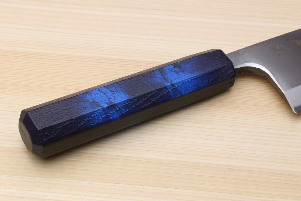 Japanese deba knife handle close-up with stainless blade