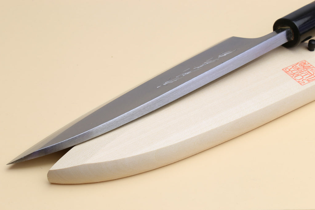 Deba knife shown side view: tapered white steel blade with dark rosewood handle