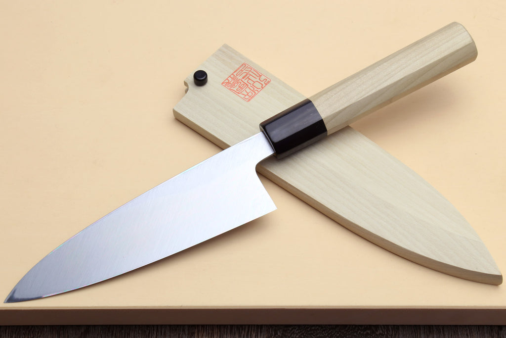 Fish fillet chef knife laid sideways with light wood handle, dark bolster, silver blade