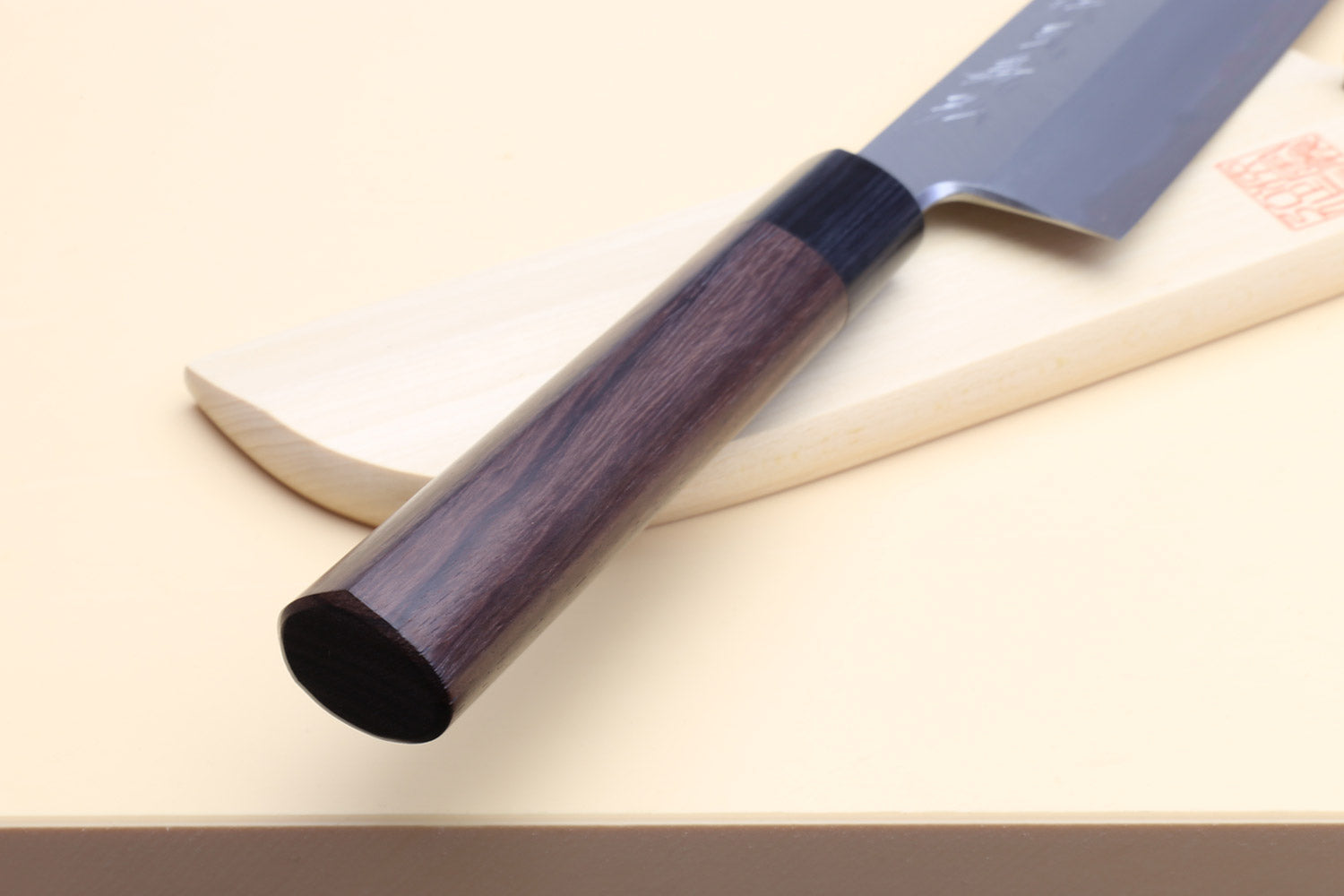 Japanese vegetable chef knife with curved blade and dark rosewood handle