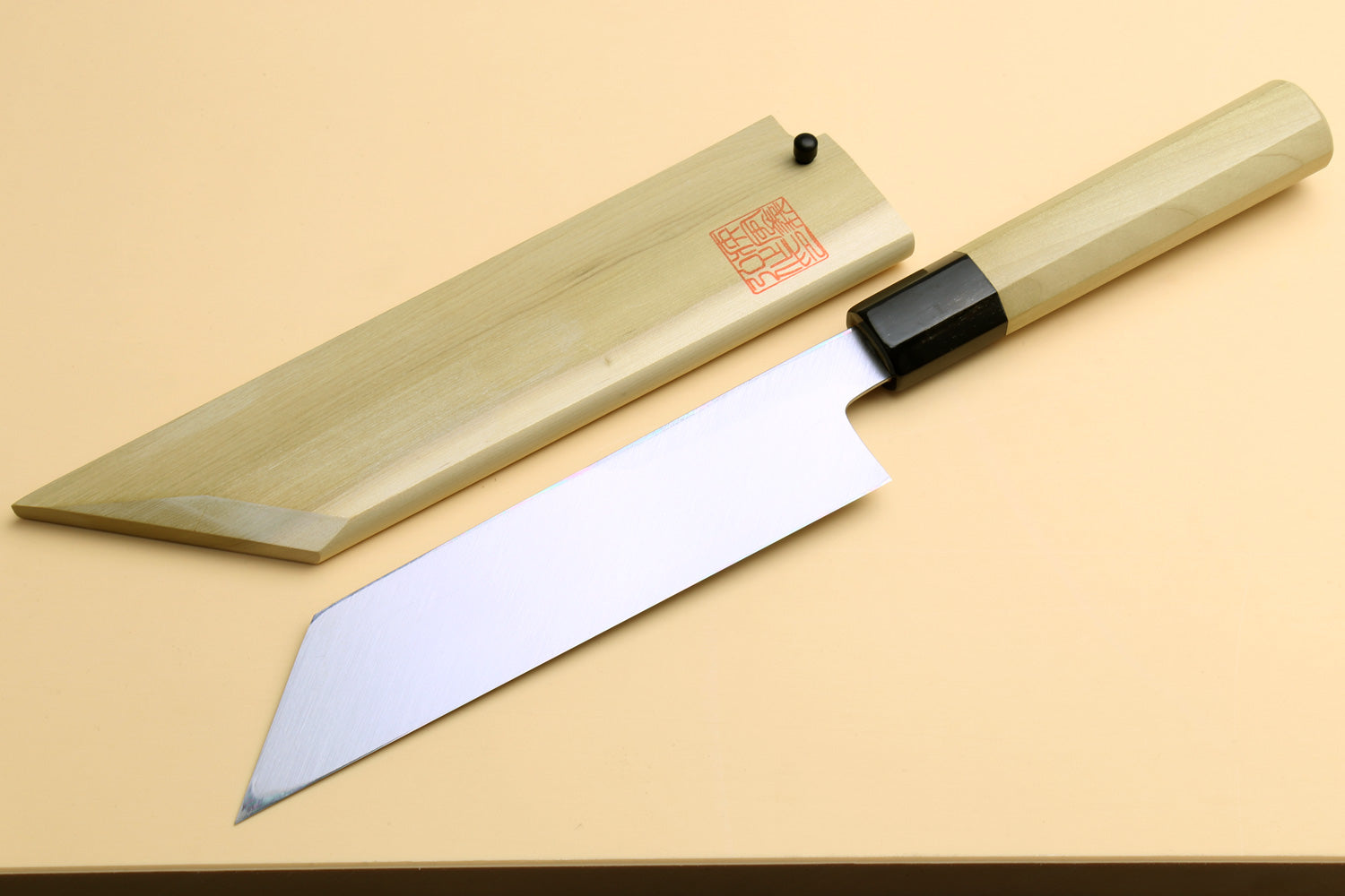 Japanese vegetable chef knife angled view, pale wood handle and black collar