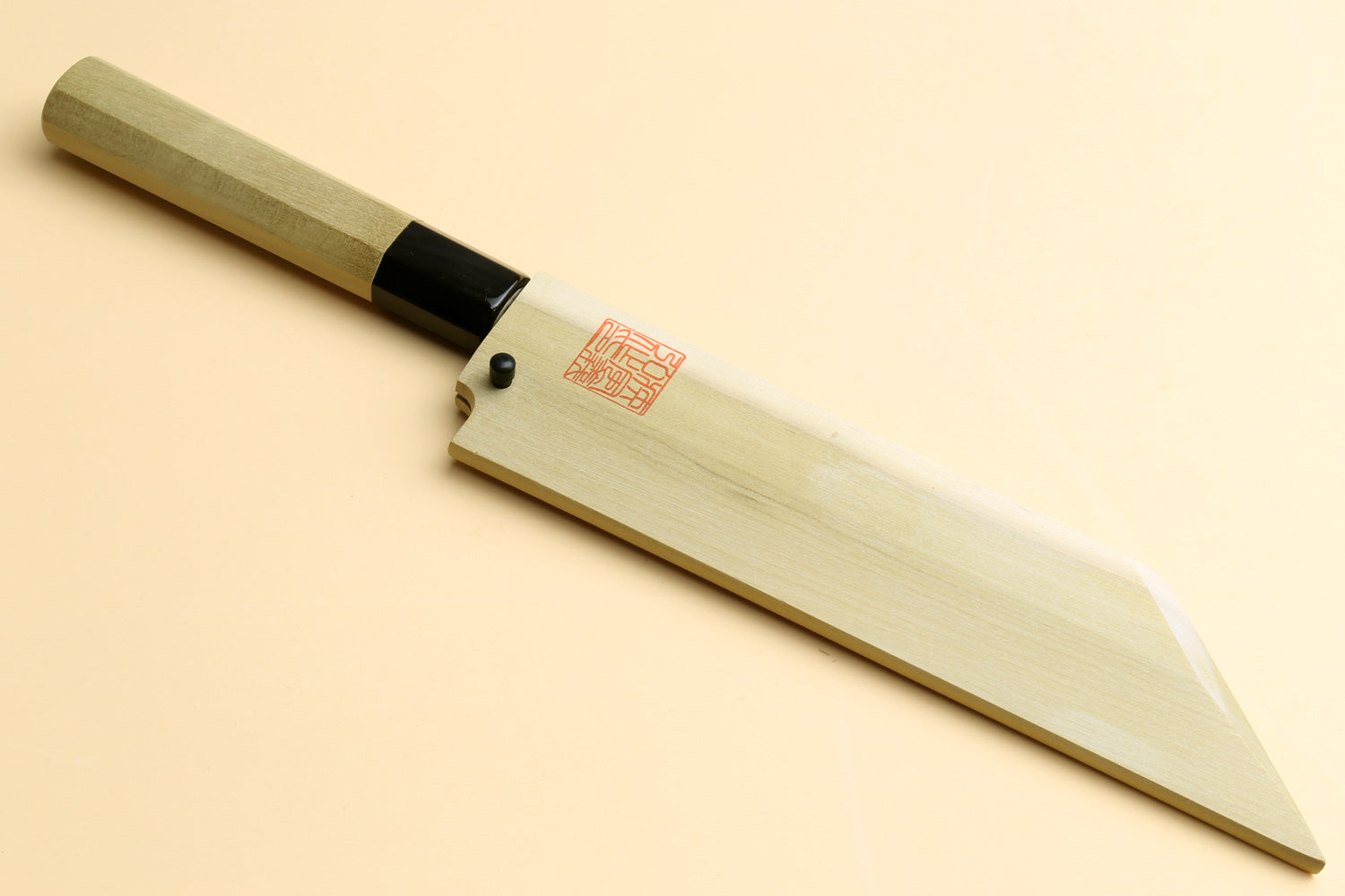 Japanese vegetable chef knife top view, pale wood handle, black collar, white steel blade