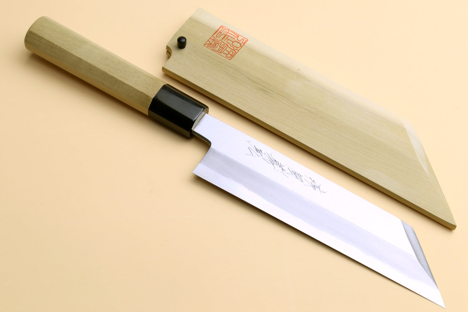 Japanese chef knife with pale wood handle, black collar, white steel vegetable blade