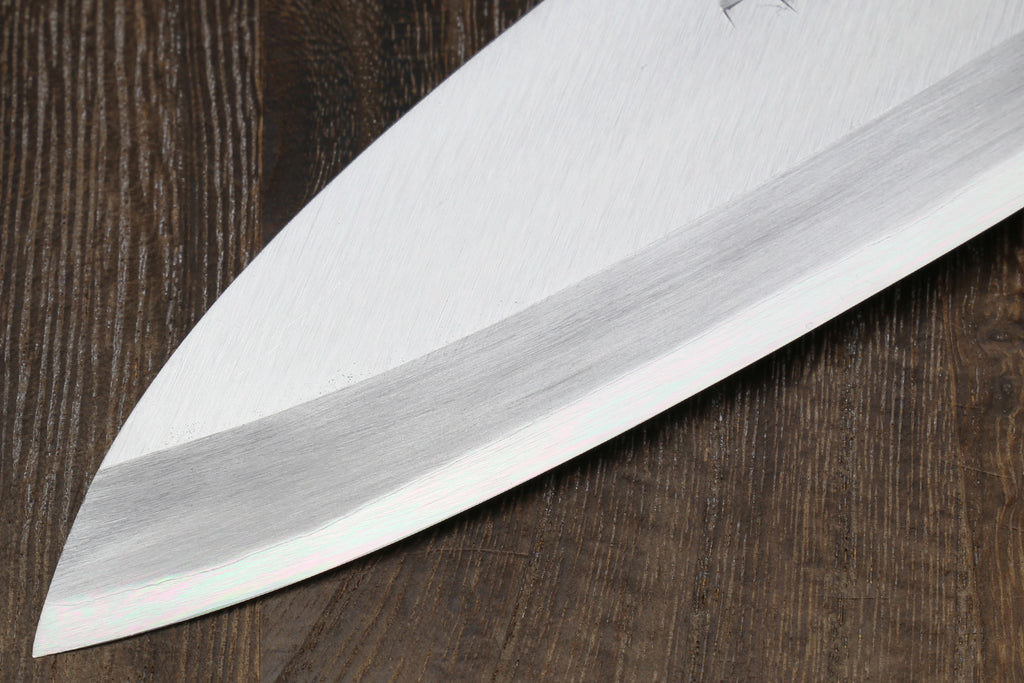 Left-handed deba fish fillet knife, white blade close-up and dark shitan handle