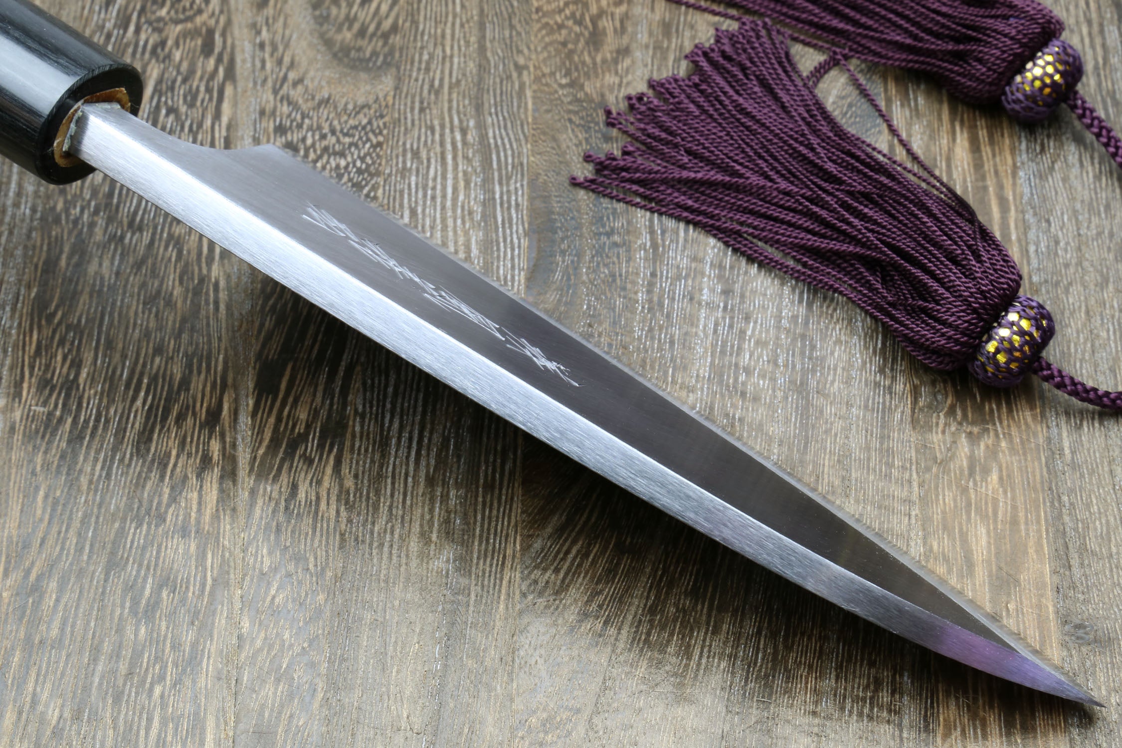 Left-handed deba fish fillet knife, white blade and dark shitan handle
