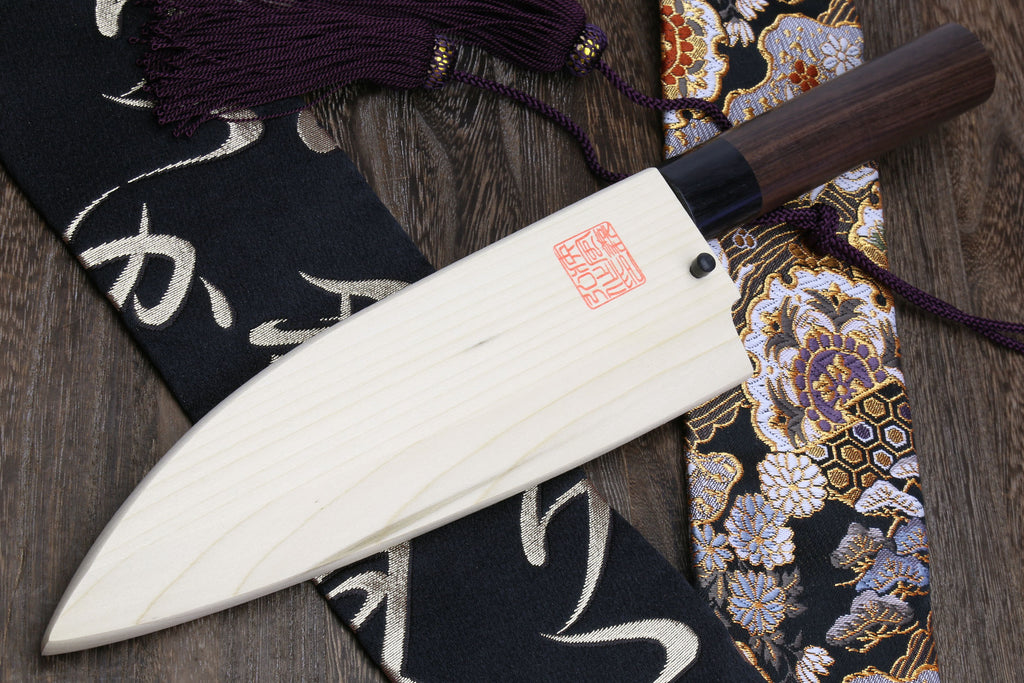 Left-handed deba fish fillet knife with white blade, dark shitan handle and cord grip