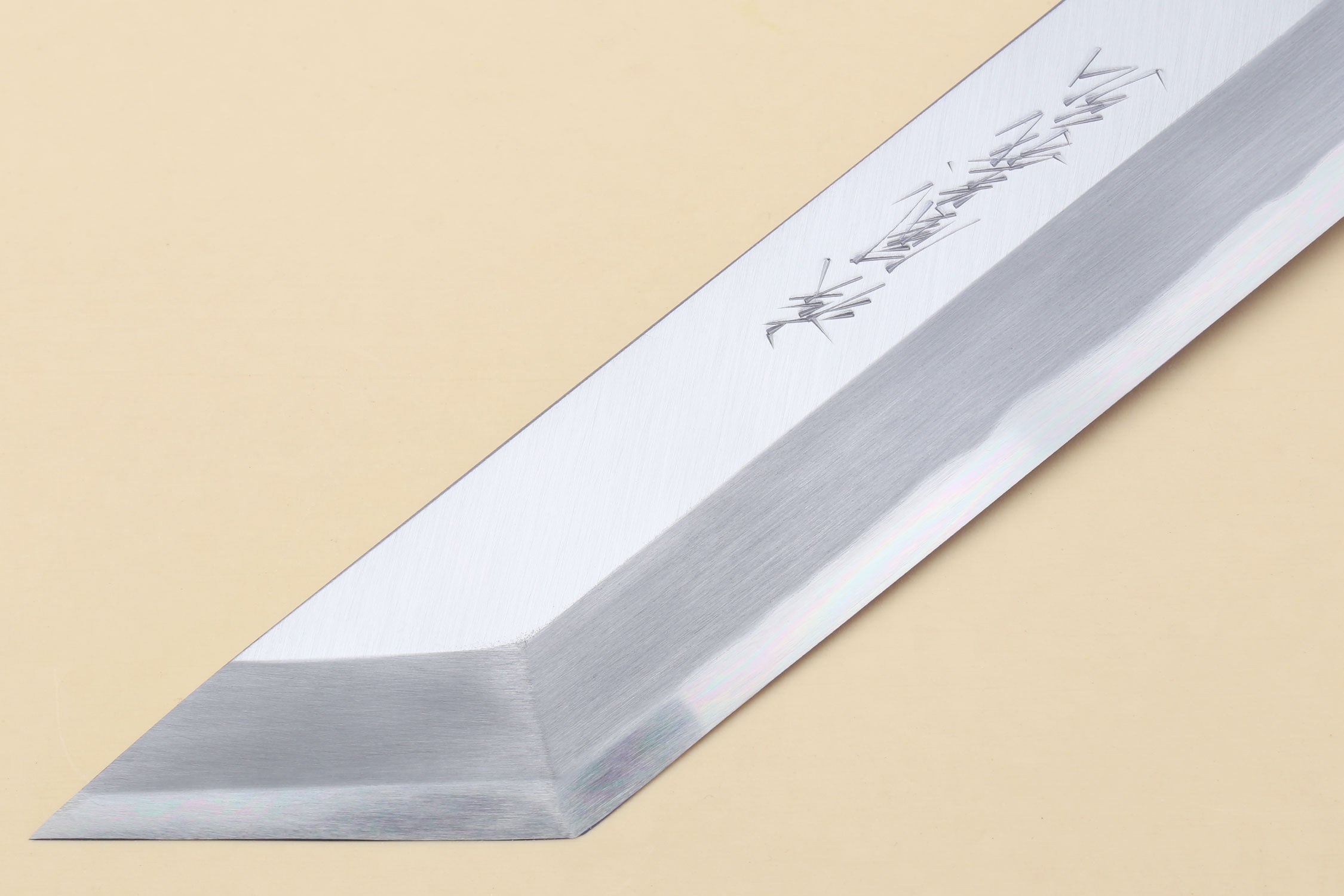 Pointed silver filet blade with etched markings