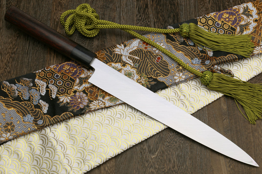 Yanagi sashimi knife with white blade and dark Shitan handle, side view