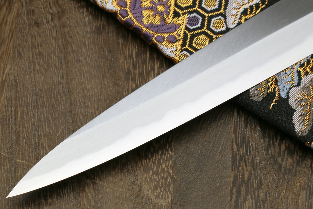 Yanagi sashimi knife with long pointed white blade and dark Shitan handle