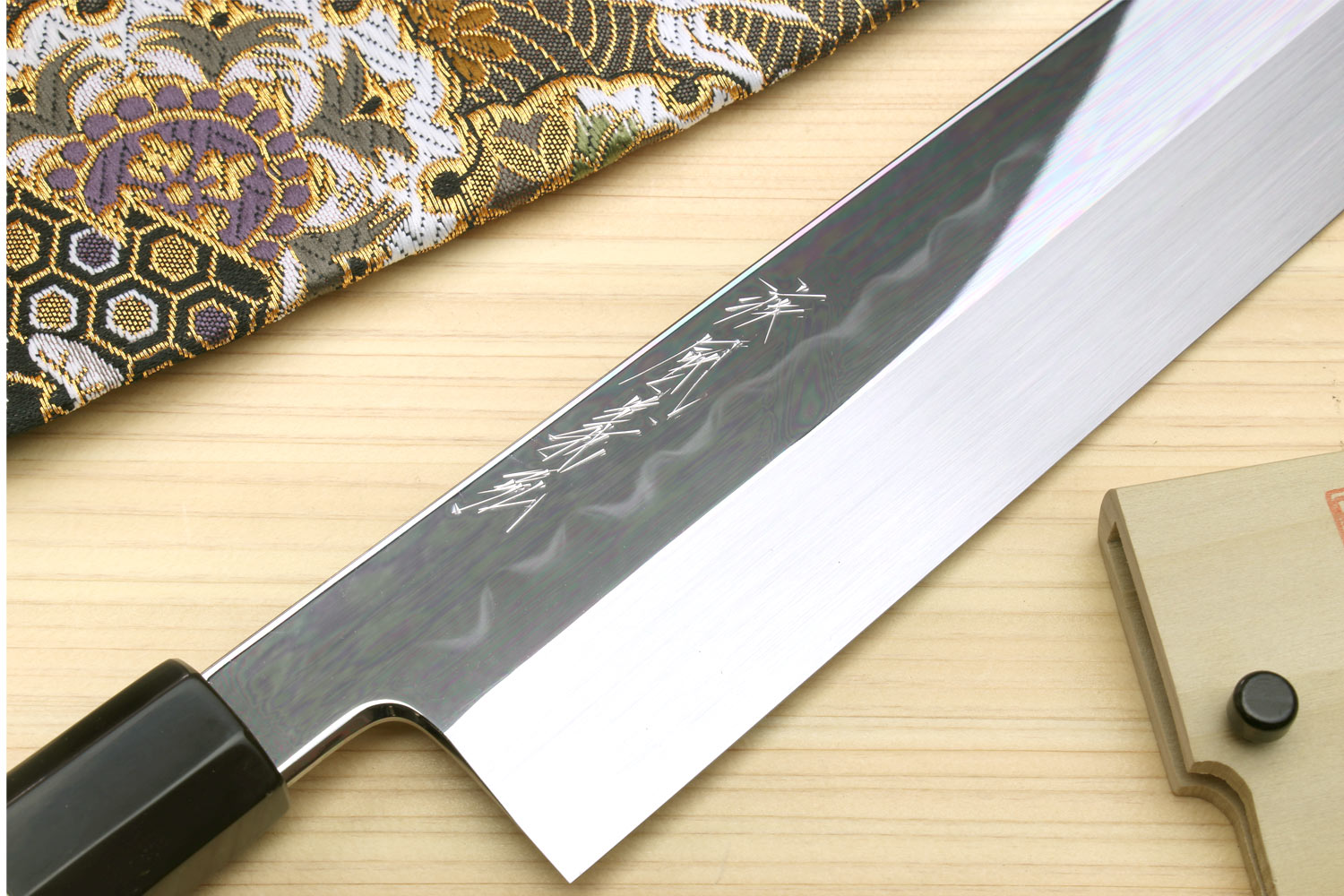 Japanese vegetable knife blade with etched pattern, dark handle with silver ring