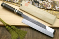 Japanese vegetable knife with etched blade and dark handle, wooden saya and cord