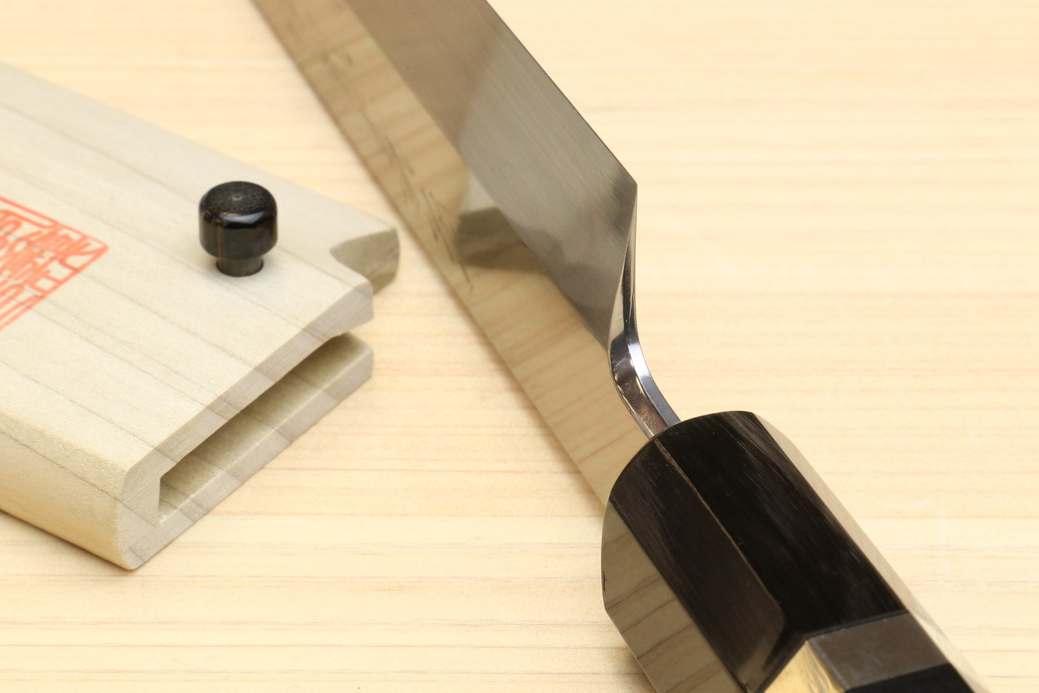 Yanagi-kiritsuke knife with dark ebony handle and mirror-finished steel blade
