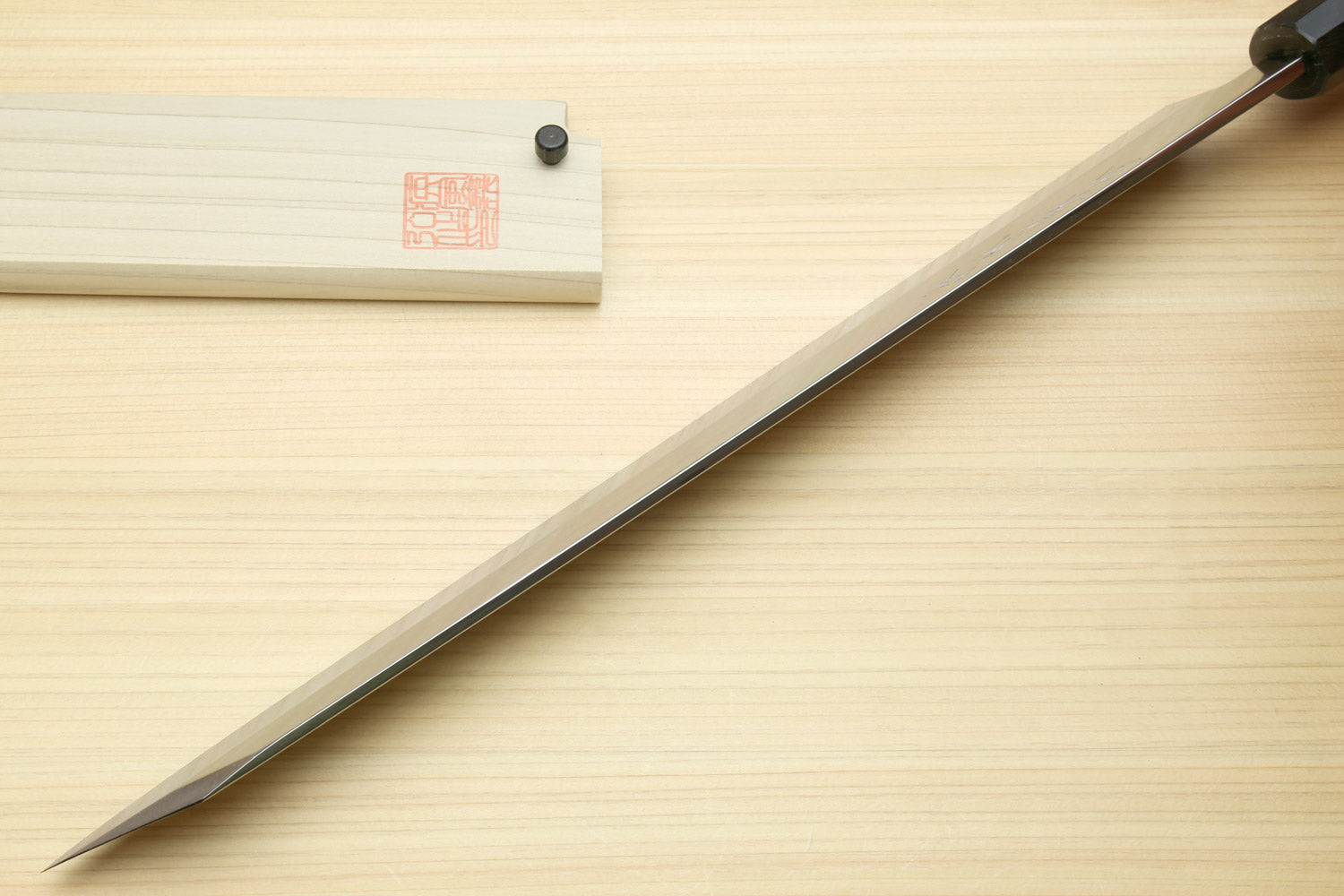 Yanagi-kiritsuke sushi knife with long mirror-finished blade and ebony handle