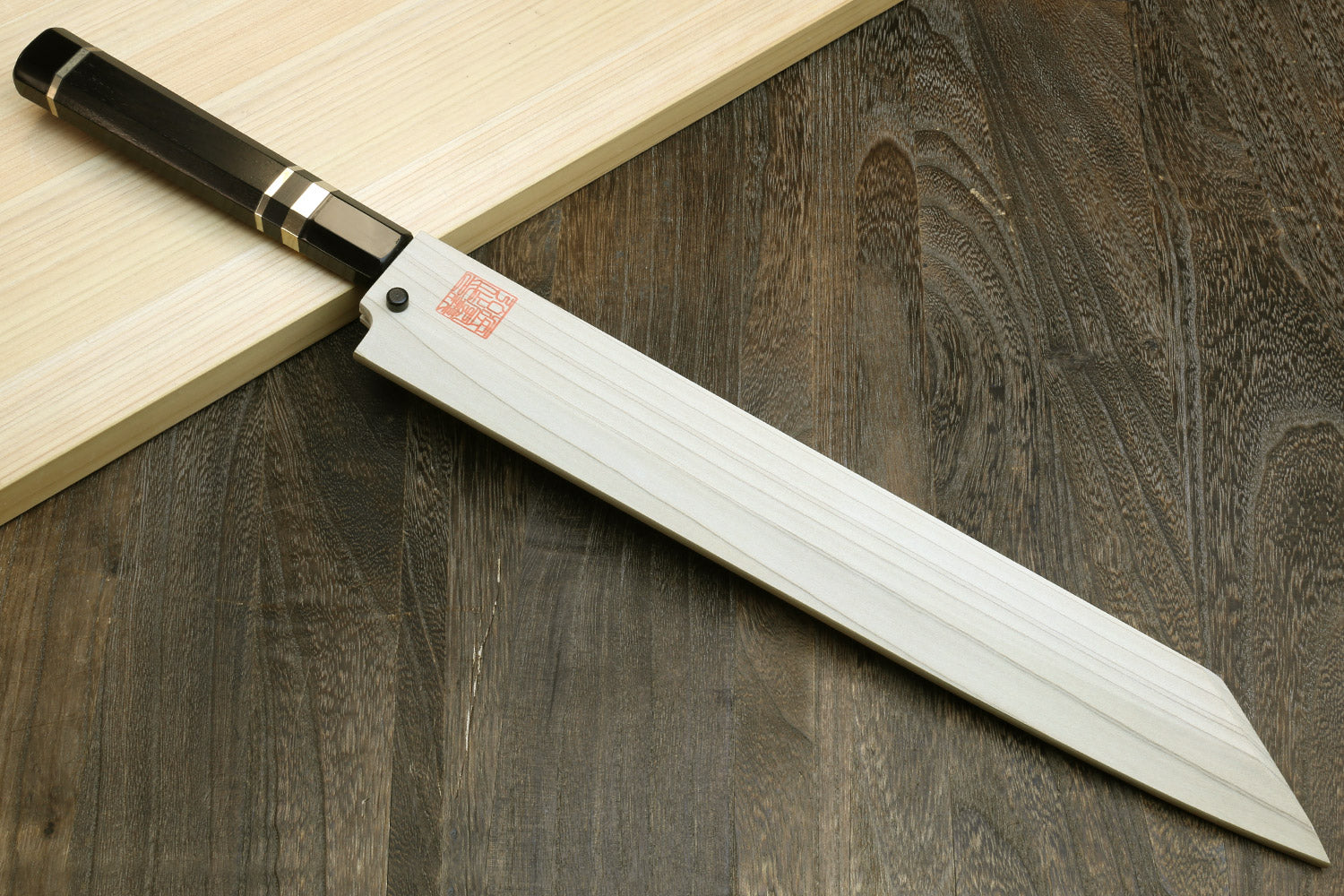 Yanagi-kiritsuke knife with ebony handle and matching wooden saya sheath