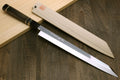 Yanagi-kiritsuke sushi knife with mirror-finished blade and wooden saya