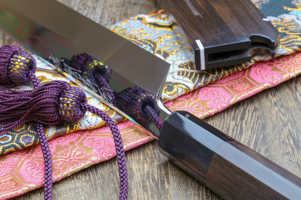 Japanese sushi knife with mirror-finished white steel blade and black handle