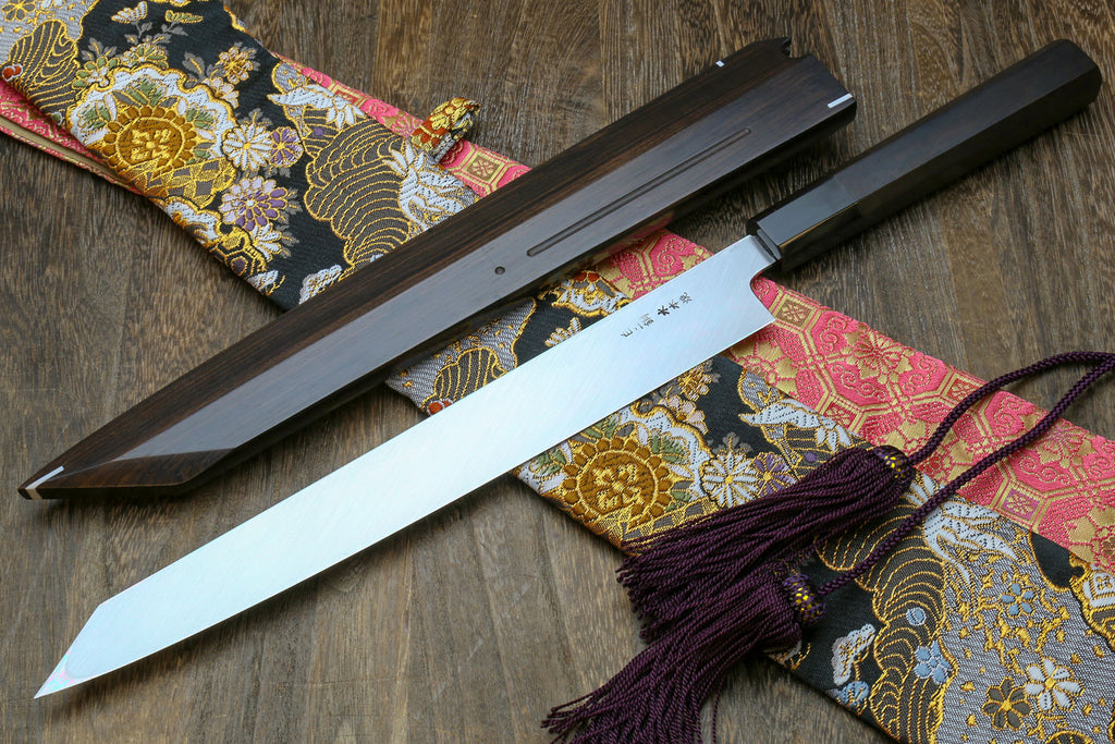 Japanese sushi knife with long mirror-finished white steel blade in black saya