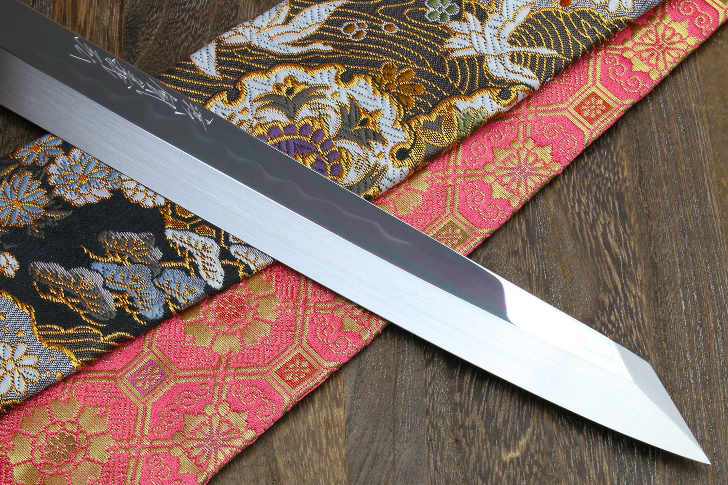 Japanese sushi knife with mirror-finished white steel blade and pointed tip