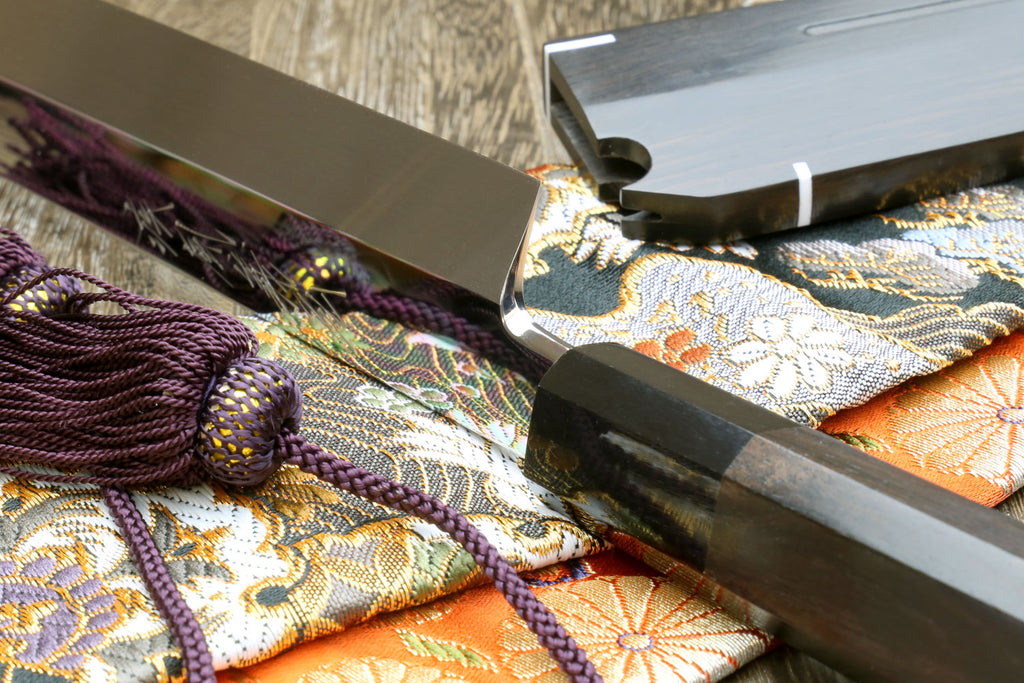 Sashimi knife with mirror-finished steel blade, ebony handle, saya, wrapped cloth and cord