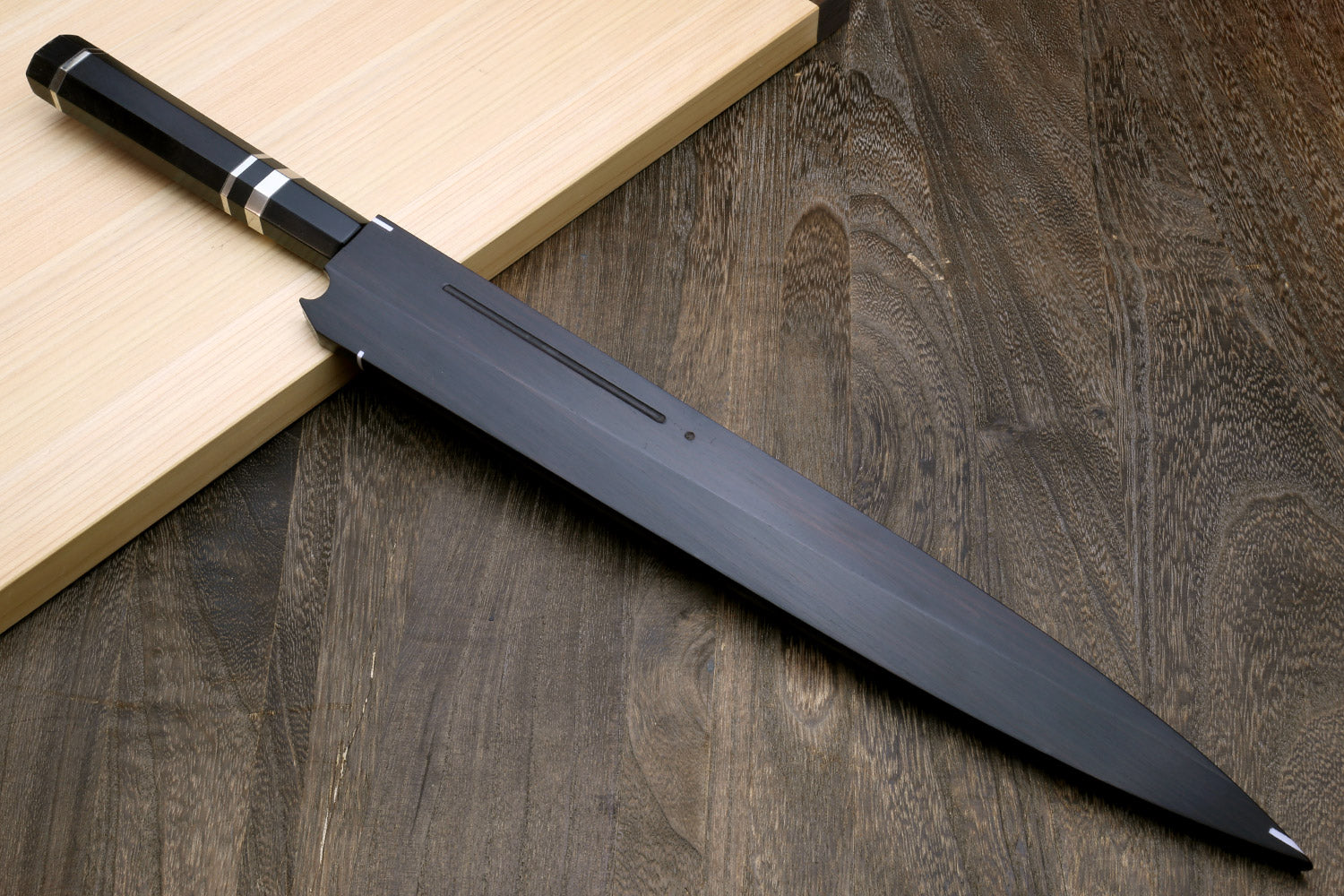 Sushi sashimi knife with dark handle and dark saya, pointed blade profile