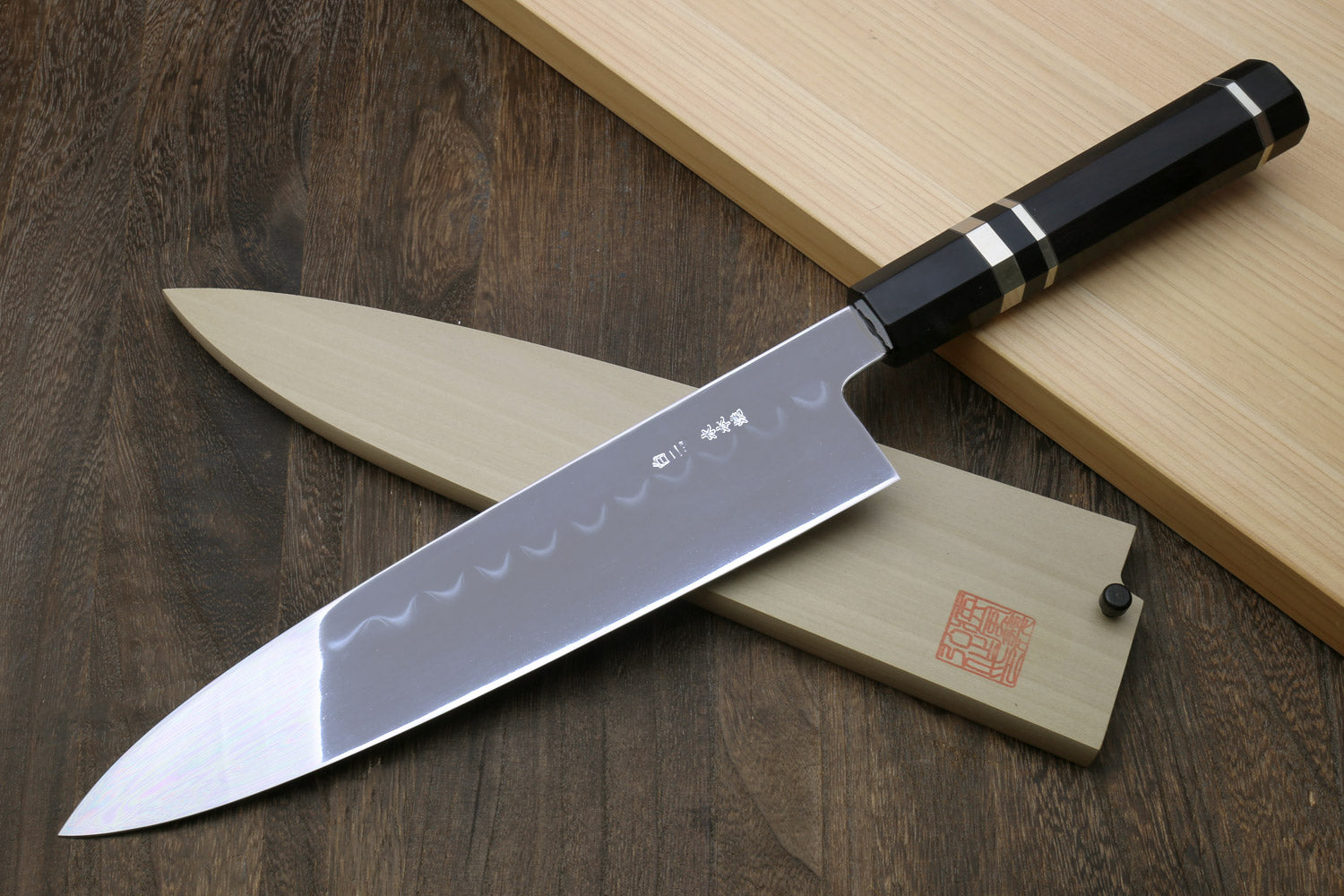 Japanese chef knife with mirror-polished silver blade and wavy hamon