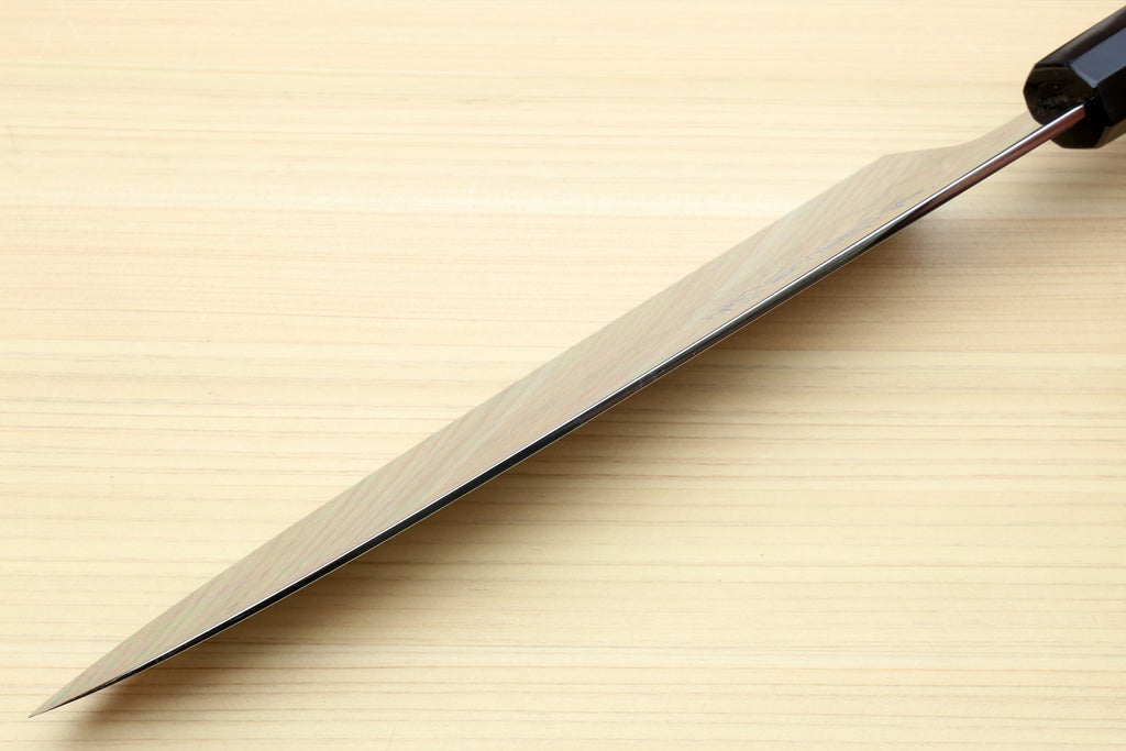 Japanese chef knife with long mirror-polished blade and dark handle