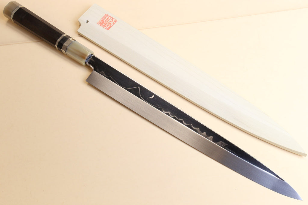 Japanese kitchen knife with dark handle and silver ring ferrules