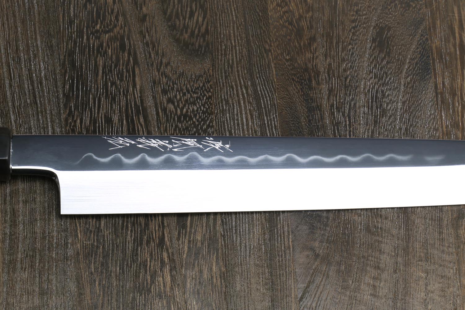 Yanagi knife blade side view, hammered white steel with mirror polish