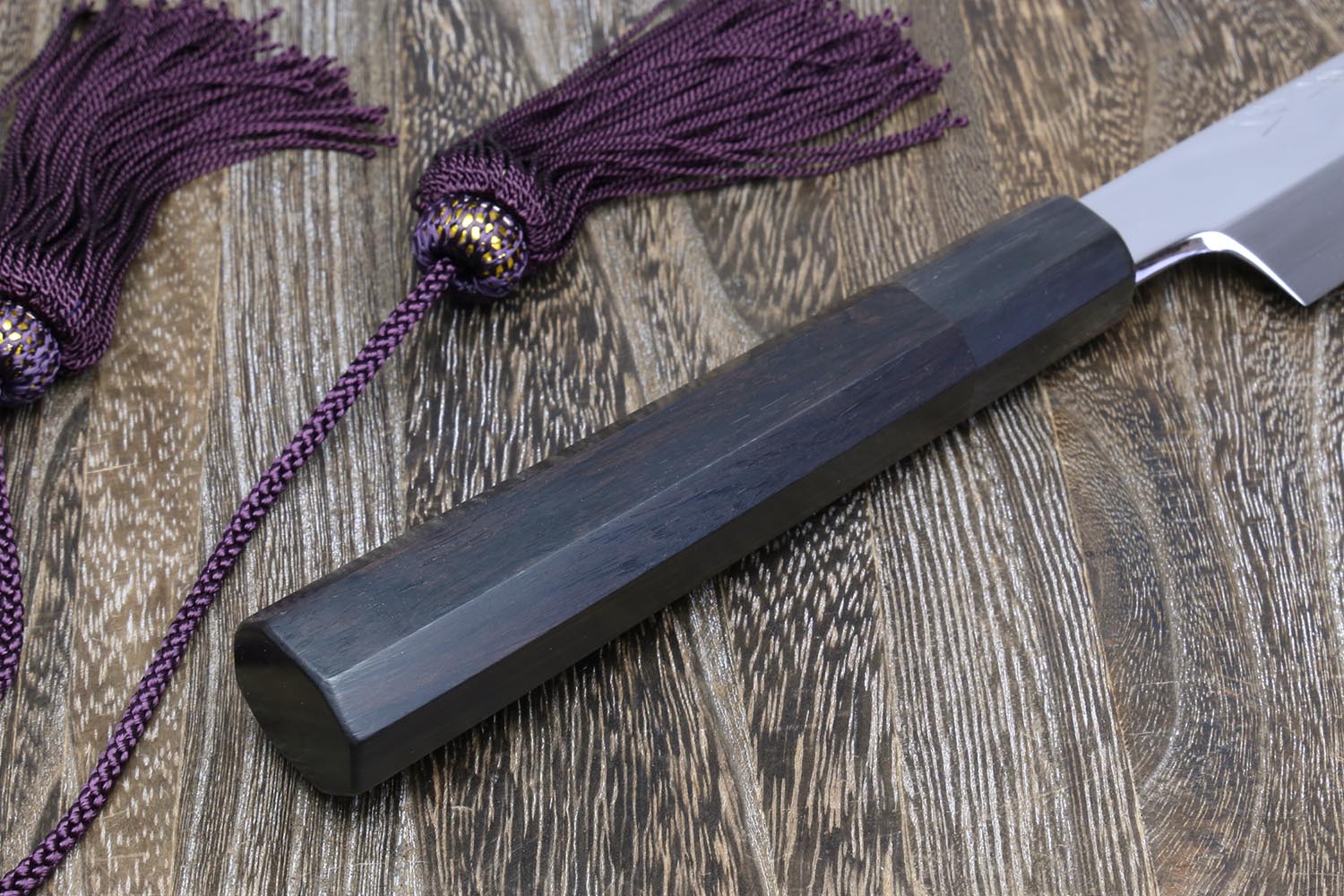 Yanagi knife with dark ebony handle and mirror-finished white steel blade