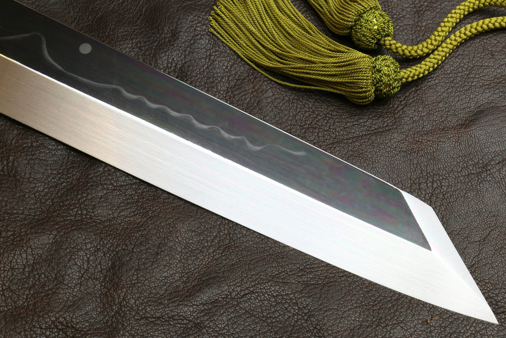 Japanese-style kitchen knife with dark handle and long pointed wavy steel blade