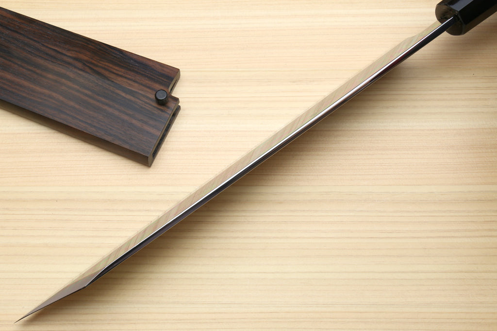 Kiritsuke chef knife with black handle and pointed white steel blade
