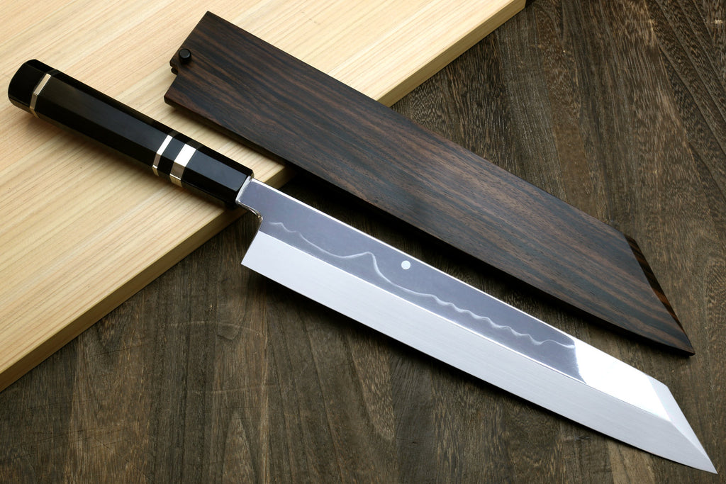 Kiritsuke chef knife with polished white steel blade and matching dark saya sheath