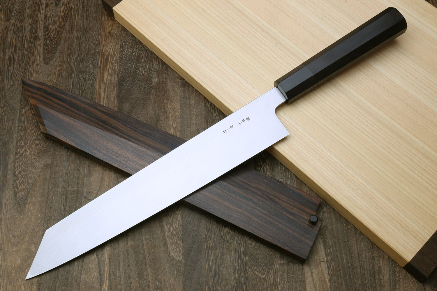 Japanese kitchen knife with white-steel blade, ebony handle, and ebony saya