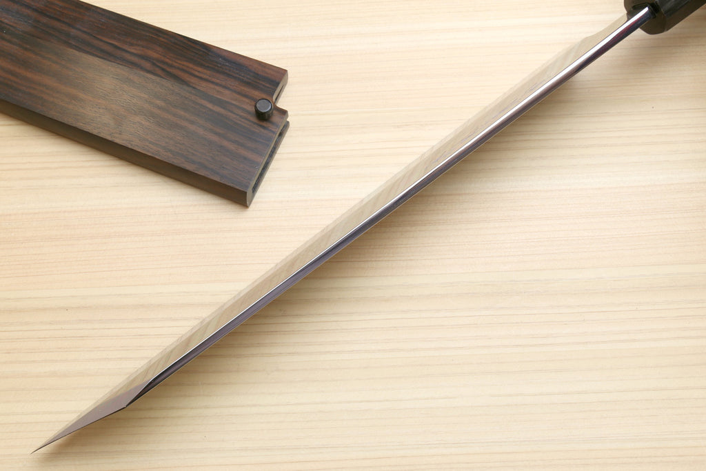Japanese kitchen knife with long white-steel blade and dark handle