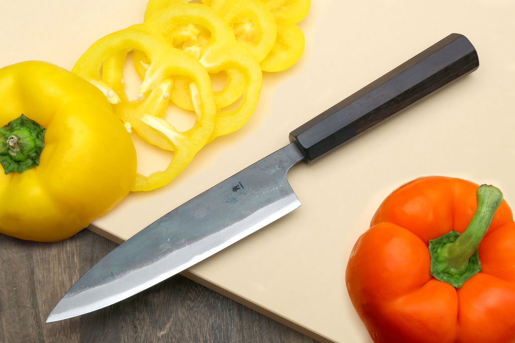 Kurouchi petty utility knife with blue steel blade and dark shitan handle