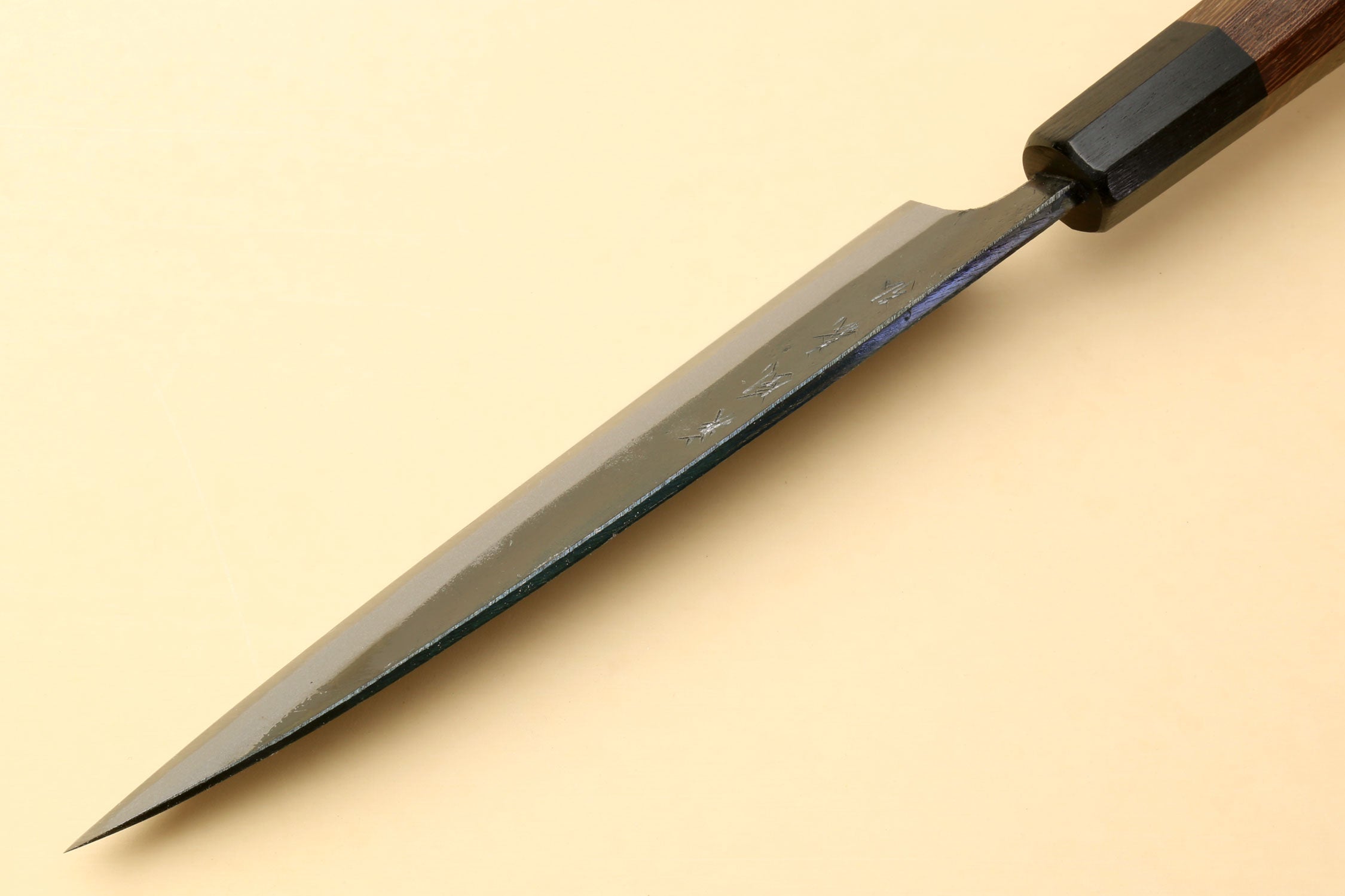 Kurouchi petty knife with long pointed blade and dark shitan handle