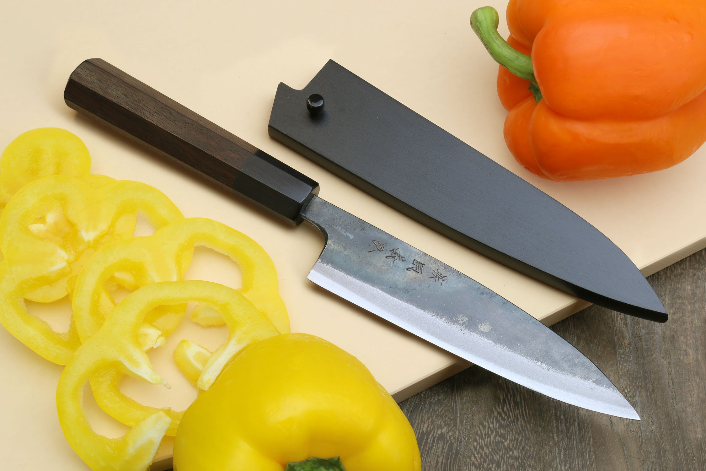 Kurouchi petty knife set with two matching blades and dark shitan handles