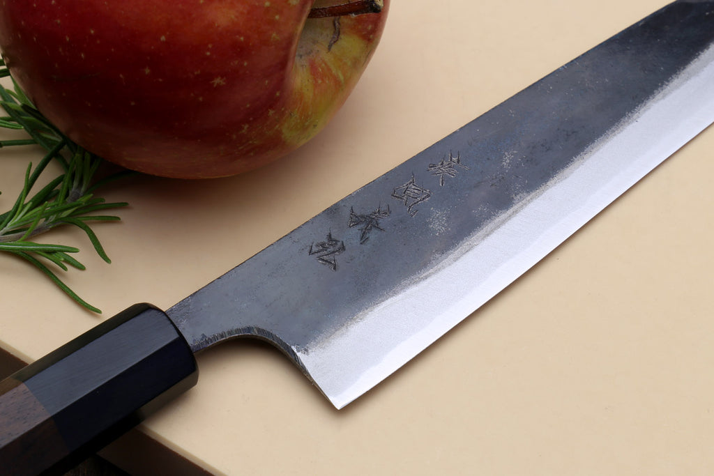 Petty kiritsuke knife with arched tip, kurouchi blade, and dark shitan handle