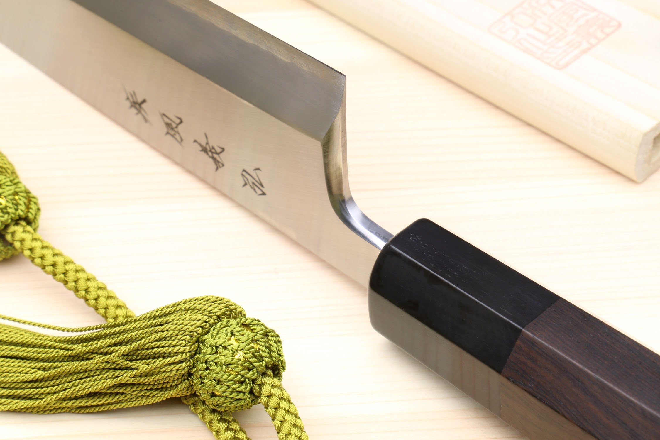 Japanese fish filet knife with ebony handle, silver blade and wrapping cord detail