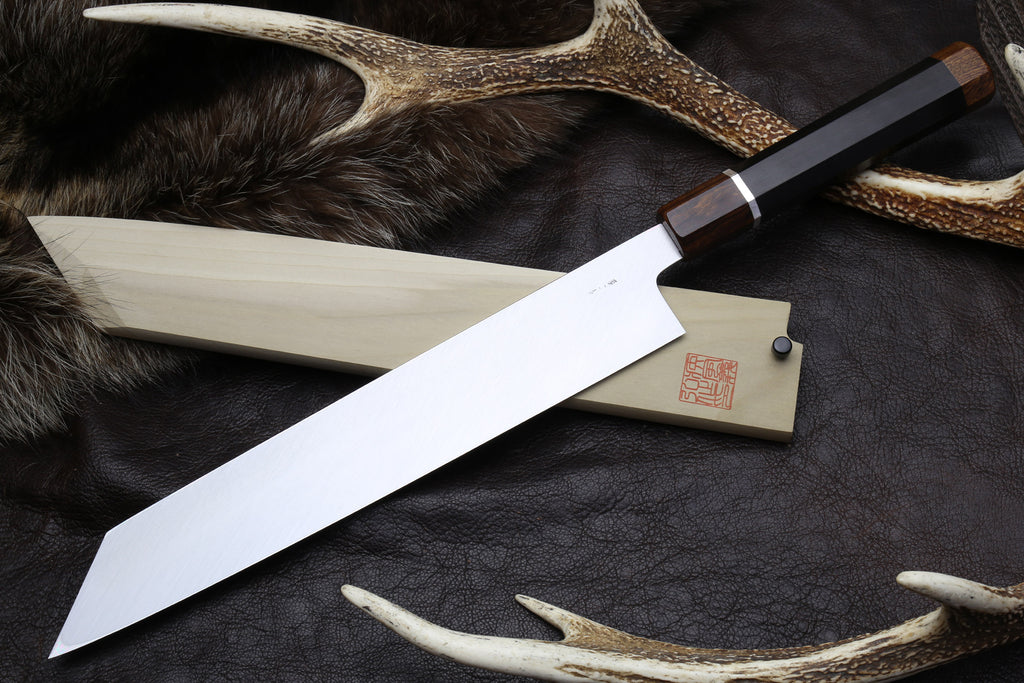 Japanese kiritsuke knife with long mirror-finished blade, dark handle, silver ferrule